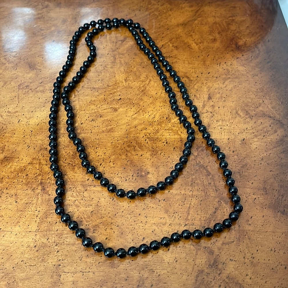 Black beaded strand necklace